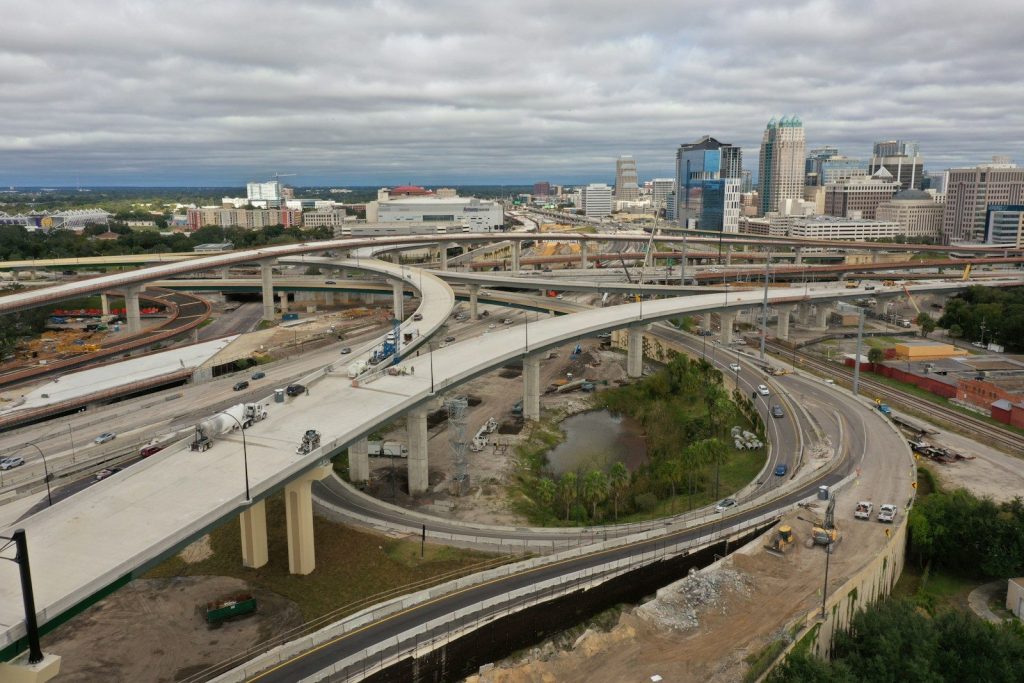 Central Florida cars on road near city buildings during daytime